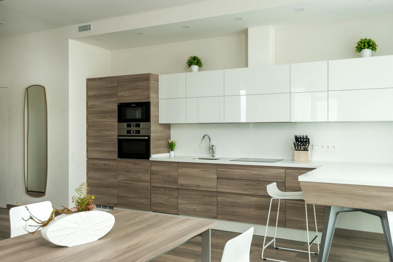 Contemporary kitchen interior with wood cabinets and sleek decor.