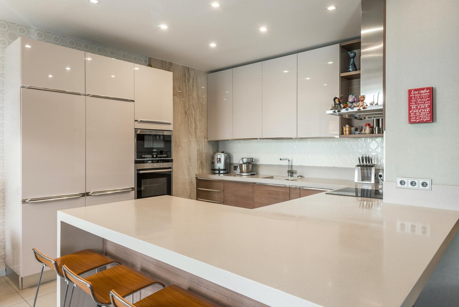 Stainless Steel vs Hard Anodized Cookware: Which is Best for Home Cooking 8 Contemporary kitchen featuring sleek cabinets, countertops, and modern appliances.